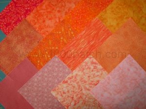 12 coupons de tissu patchwork orangés 15 x15 cm