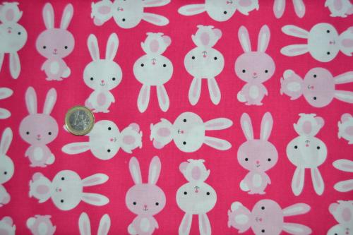 Tissu patchwork petits lapins pêle mêle sur fond rose